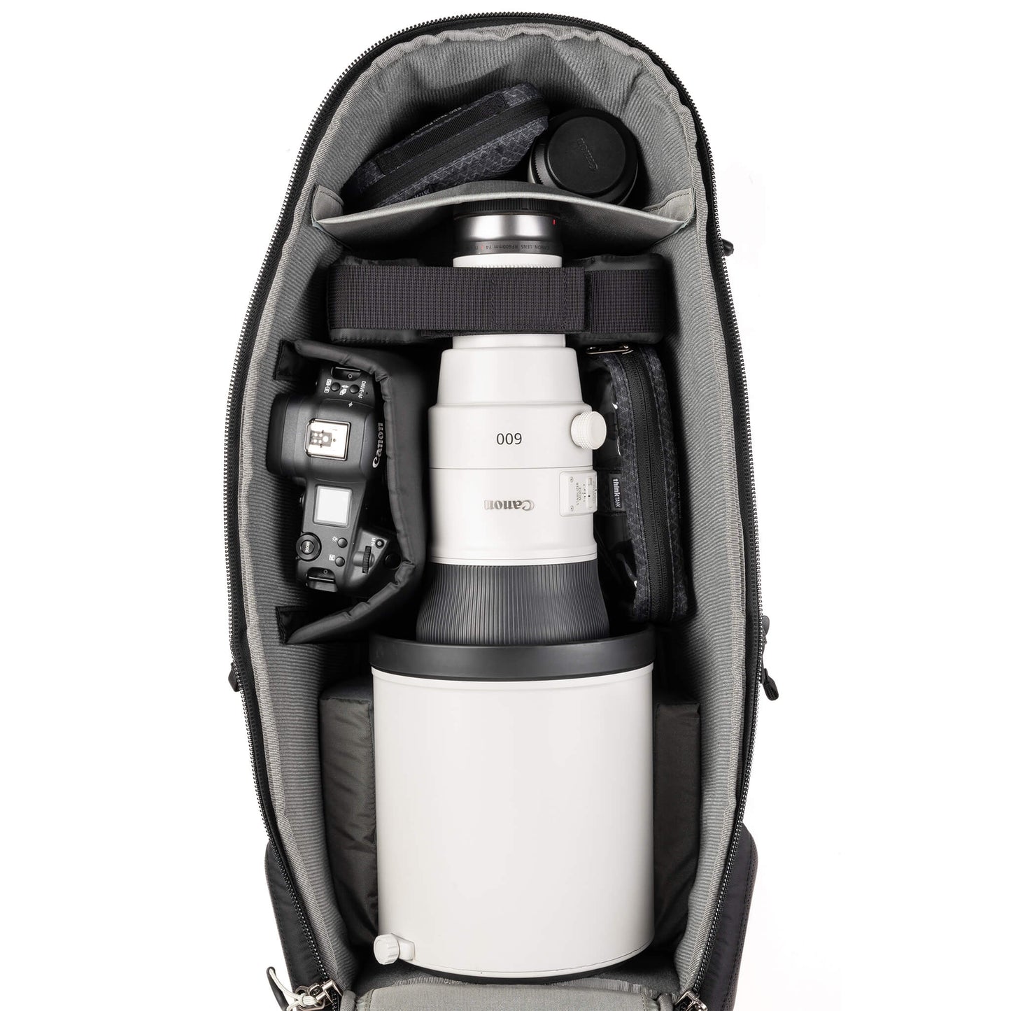 Deep photo compartment for large lens hoods up to 8 inches in diameter, gripped bodies, vertical storage of long lenses, and stacking of short lenses.
