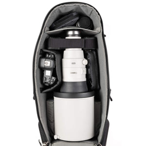 Deep photo compartment for large lens hoods up to 8 inches in diameter, gripped bodies, vertical storage of long lenses, and stacking of short lenses.
