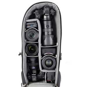 Alternatively carries a large kit consisting of two gripped bodies attached to lenses, plus room for an additional 2-6 lenses and/or accessories