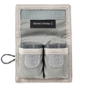 Battery Holder 2 Compact carrier for up to two standard DSLR or Mirrorless batteries. Fits easily in your pocket or attaches to your belt or bags.