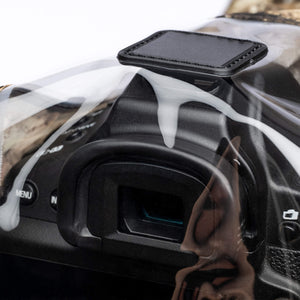 Hot-shoe mount keeps cover located on camera during use