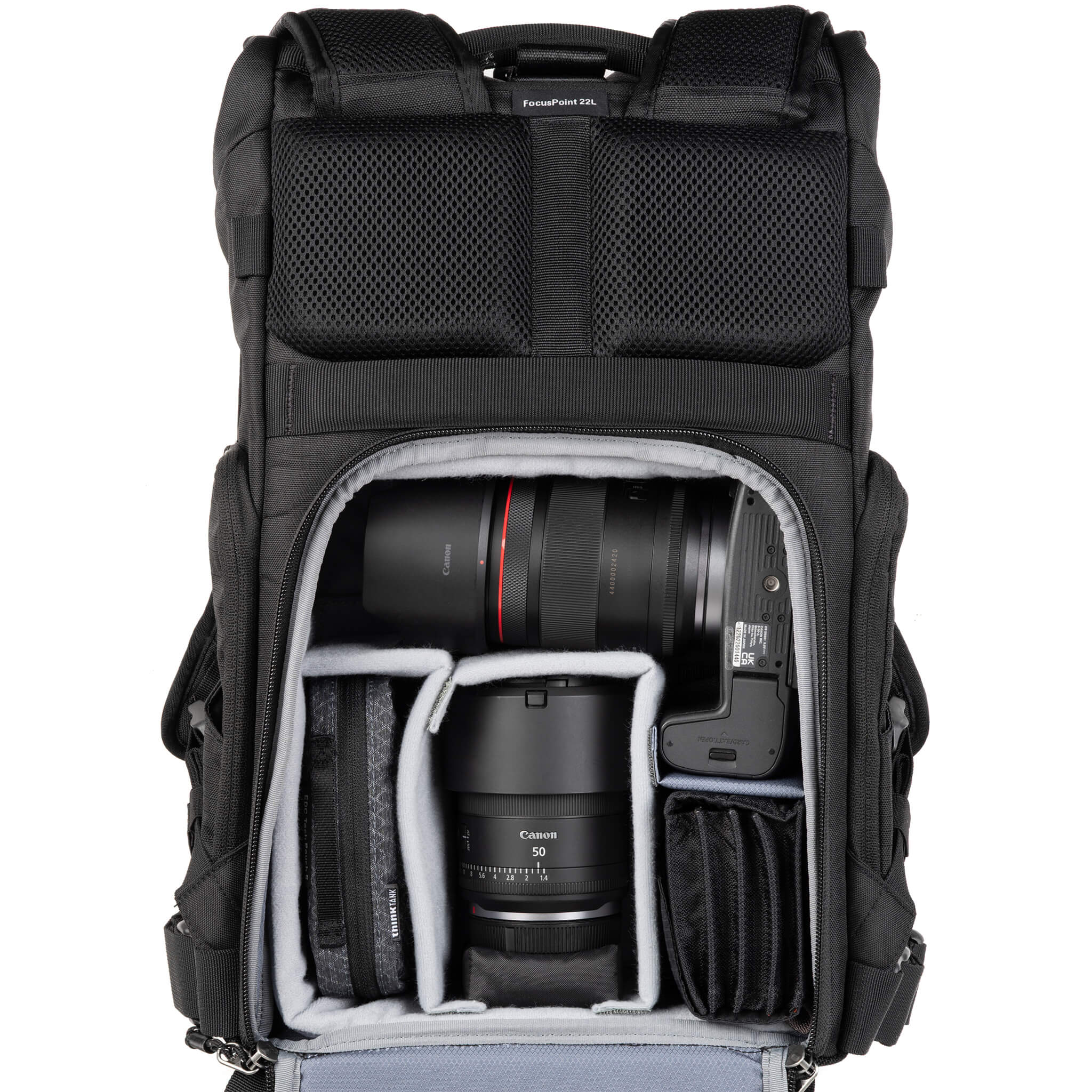 Canon R5 attached to 16-28mm f/2.8, 50mm f/1.4 and accessories. Configured for side access.
