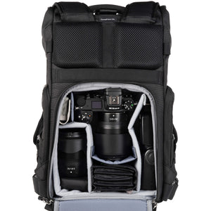 Nikon Z6 attached to 85mm f/1.8, 35mm f/1.8, flash, accessories. Configured for back access.