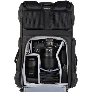 Nikon Z6 attached to 85mm f/1.8, 35mm f/1.8, flash, accessories. Configured for back access.