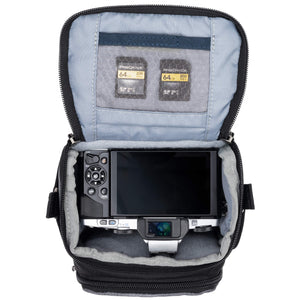 Fits one small point-and-shoot or small size mirrorless body (4/3) with small telephoto or pancake lens attached.