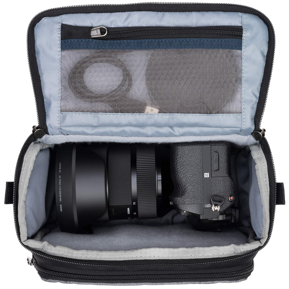 
                  
                    Fits one standard mirrorless body plus 1 to 2 lenses: short to medium f/4 zooms or short to medium primes.
                  
                