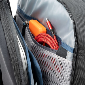 Rear compartment pocket for power cords, cables, and other important items