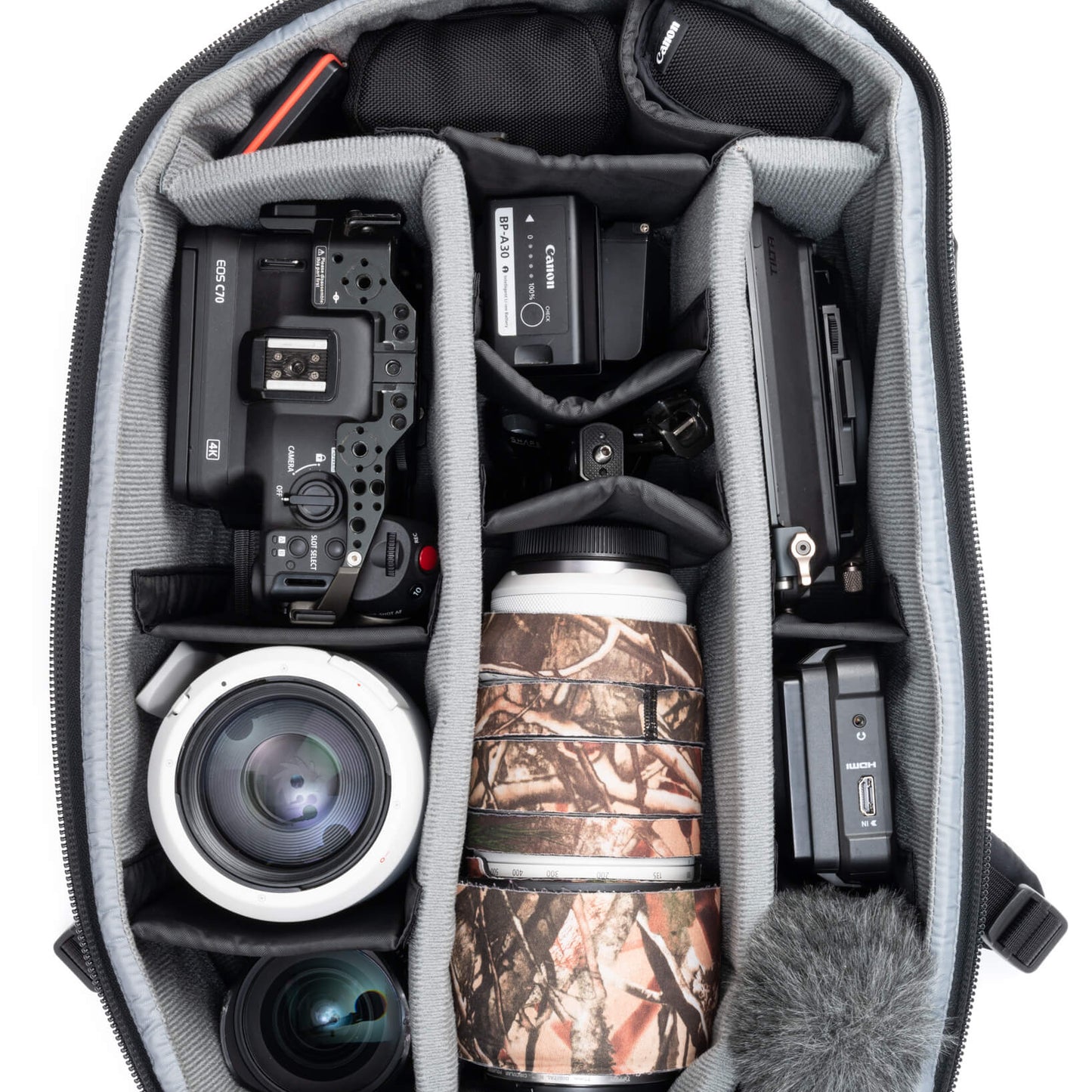 Fits two gripped camera bodies with lenses attached and an additional
4-6 standard zoom lenses