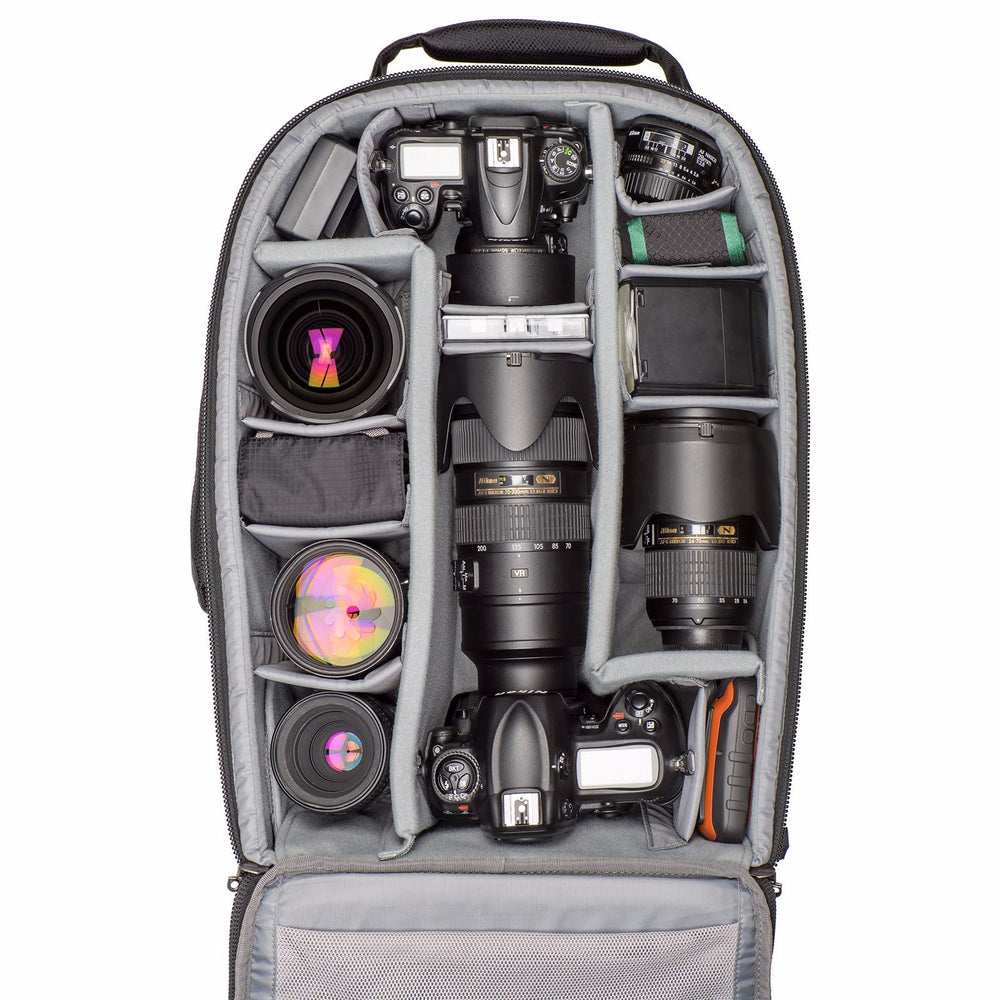 
                  
                    Nikon DSLR bodies with lenses attached, five additional lenses, flash, and accessories
                  
                