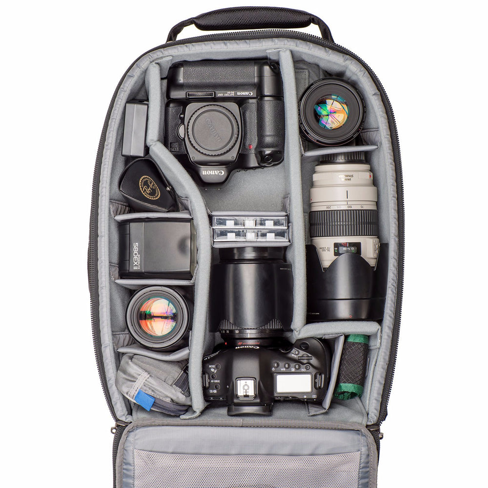 
                  
                    Gripped Canon body, standard body with lens attached, three additional lenses, flash
                  
                