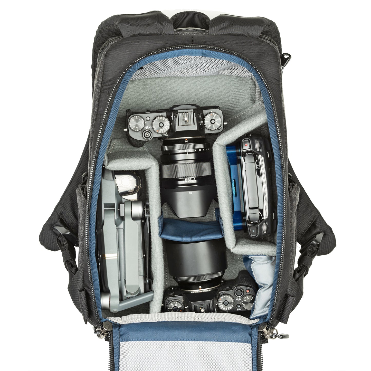 1–2 ungripped DSLR or Mirrorless body with lens attached up to a 70–200mm f/2.8, 1–3 additional lenses, a strobe, a 13” laptop, plus personal gear