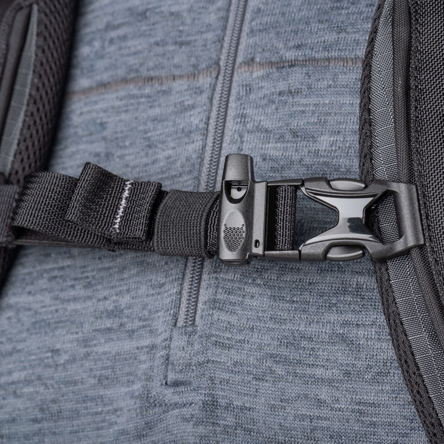 Whistle integrated into sternum strap buckle