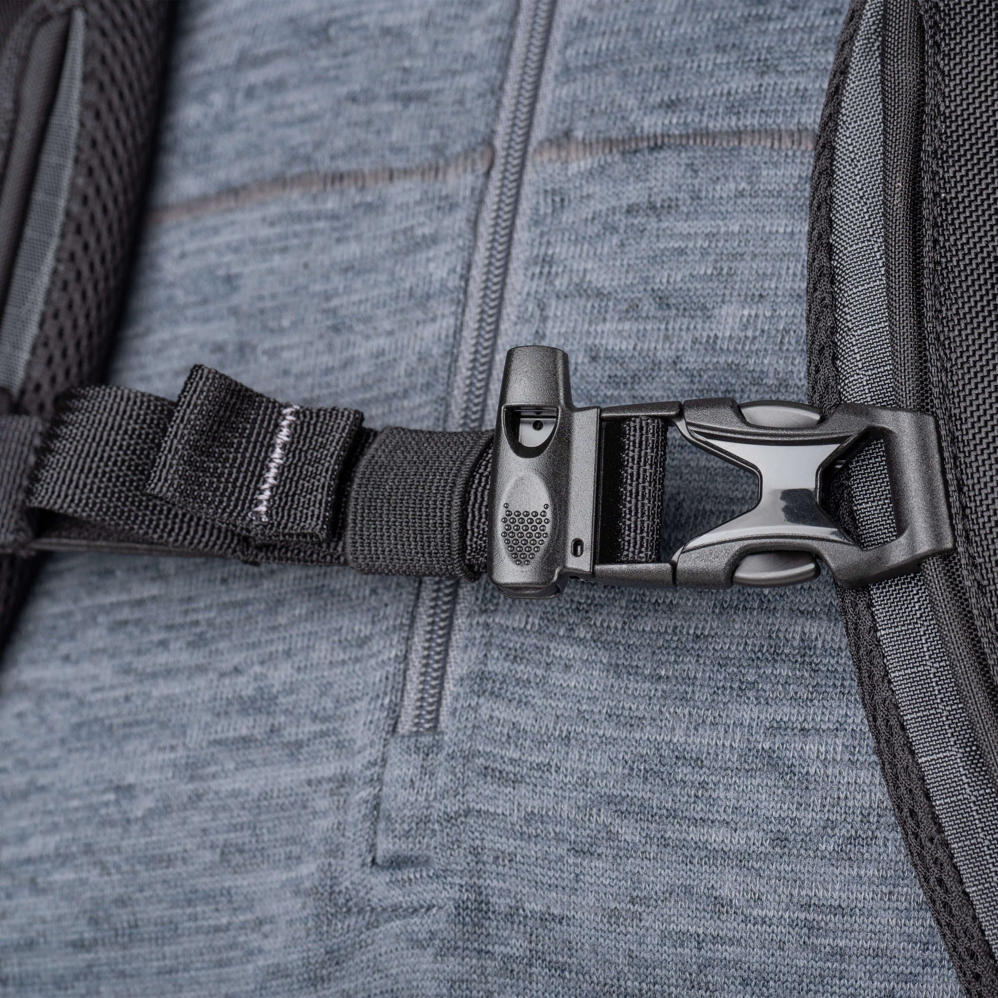Whistle integrated into sternum strap buckle