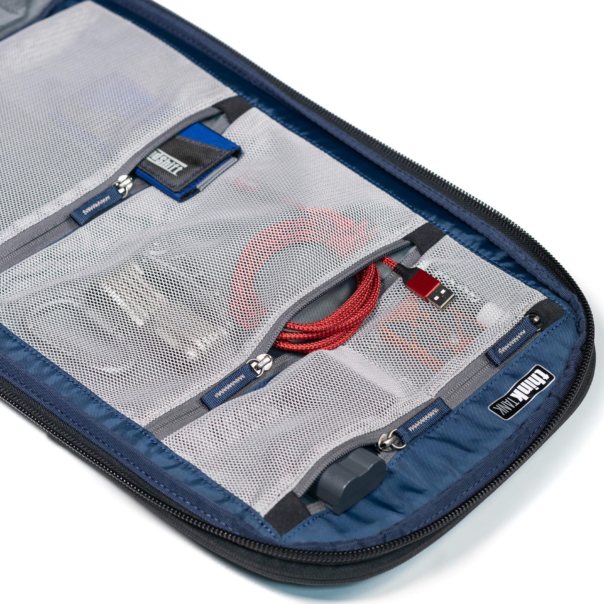 Interior mesh pockets for storing filters, batteries, cables, etc.