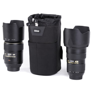 Holds a 24–70mm f/2.8 lens with lens hood in shooting position, or other similar size lenses