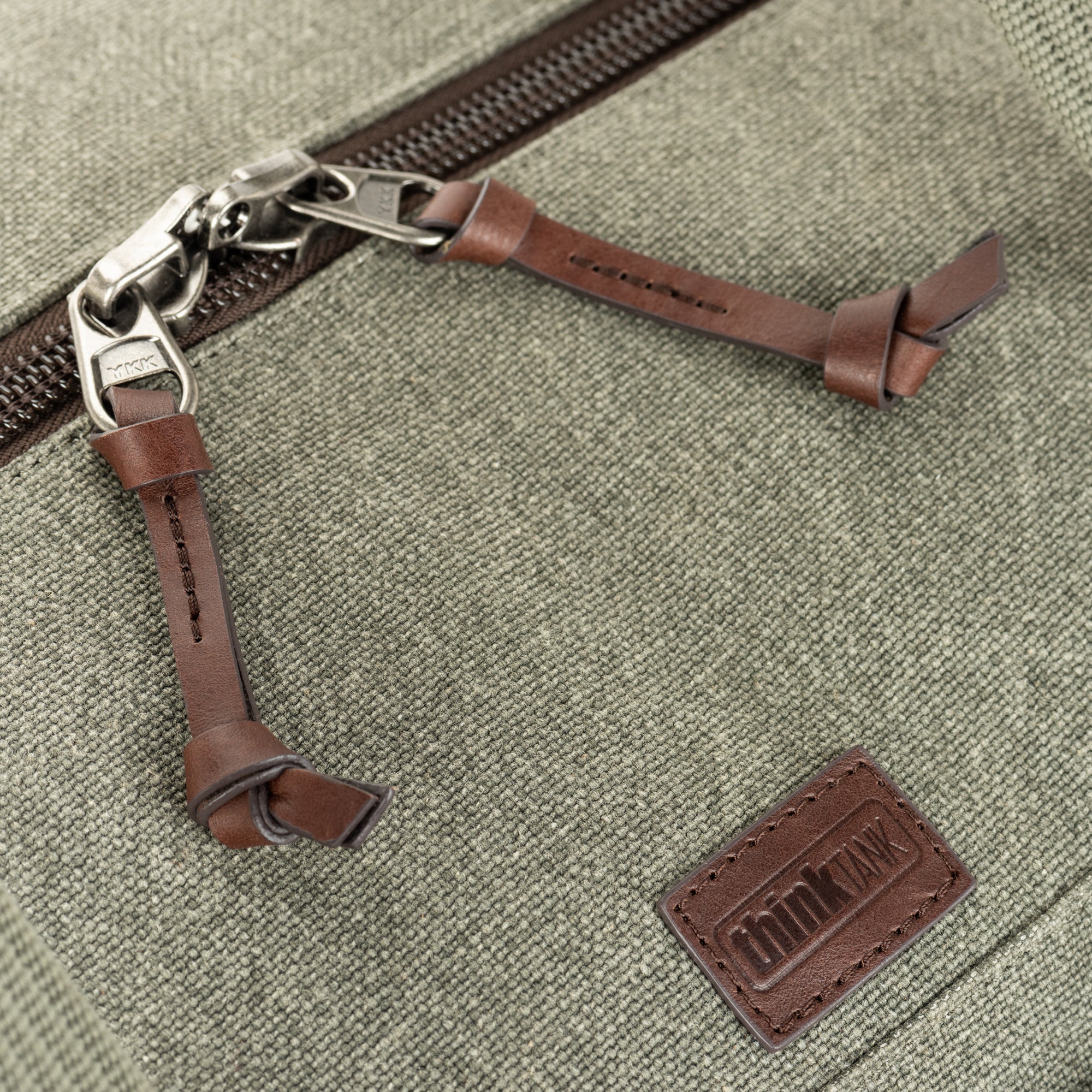 Full-grain Dakota leather zipper pulls