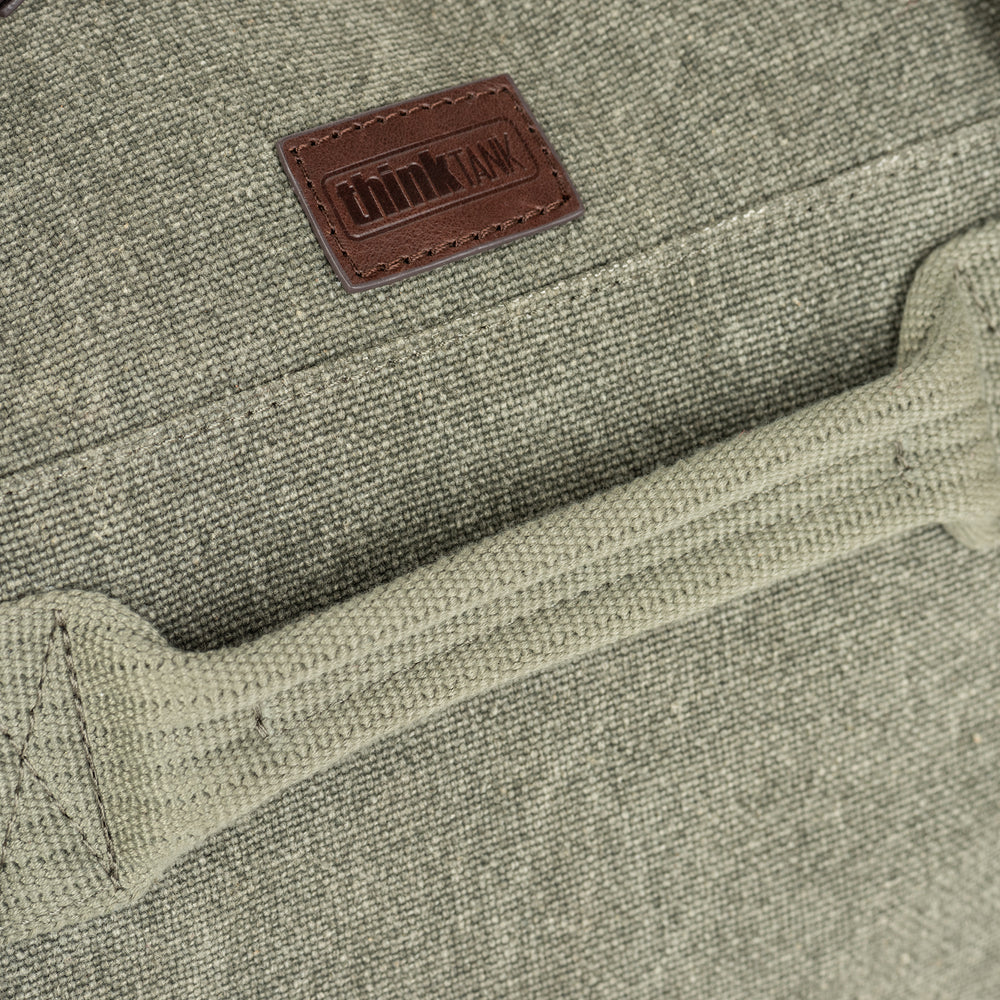 
                  
                    Stone-washed 100% cotton canvas with full-grain Dakota leather trim
                  
                