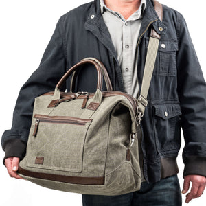 Removable, long leather shoulder strap with length adjusters on both sides and padded center