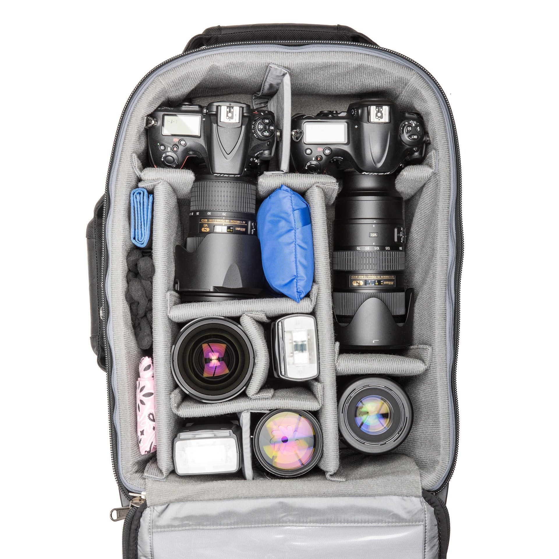 2 gripped DSLRs with lenses attached plus 2–4 additional lenses, 15” laptop and a 10” tablet