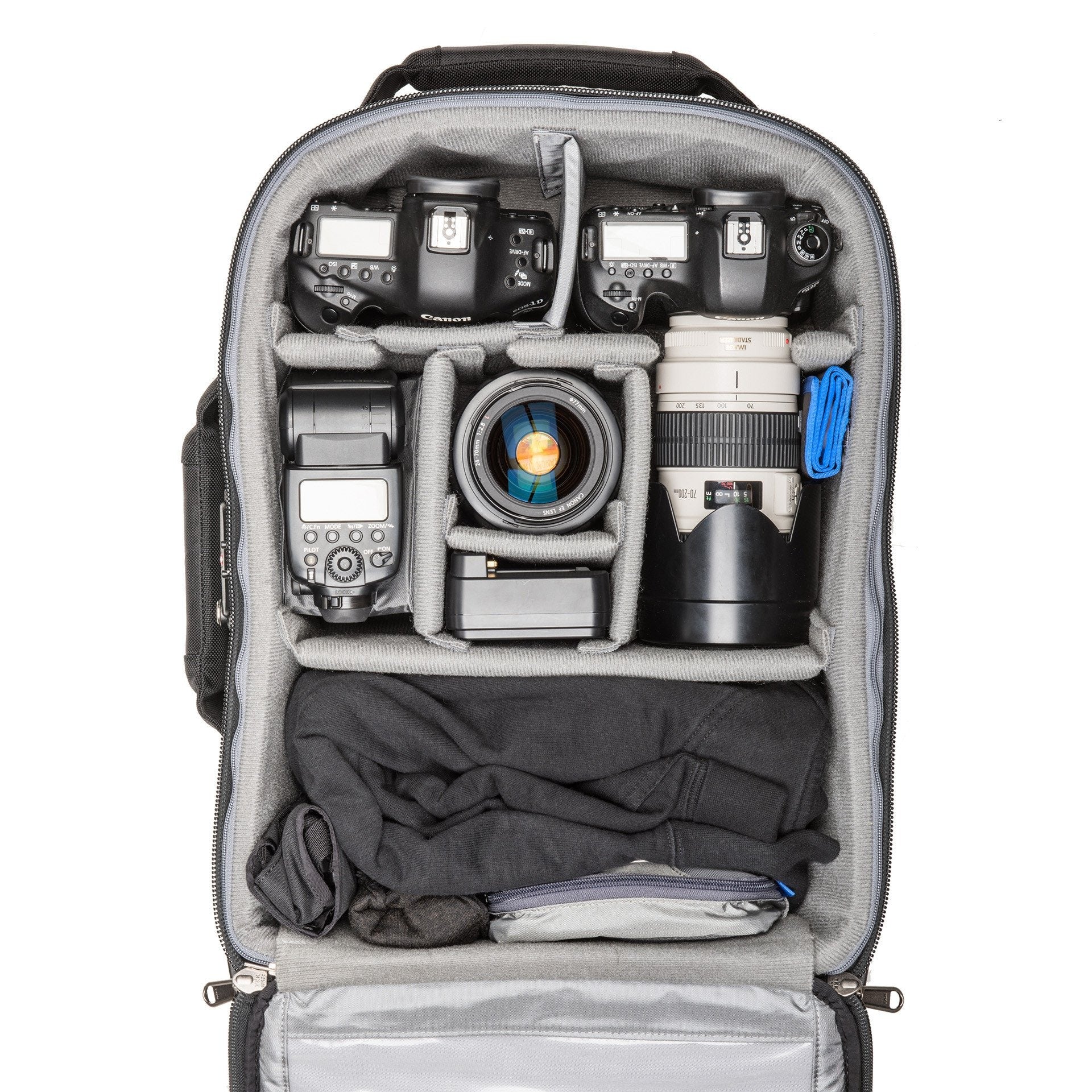 2 gripped DSLRs with lenses attached plus 2–4 additional lenses, 15” laptop and a 10” tablet