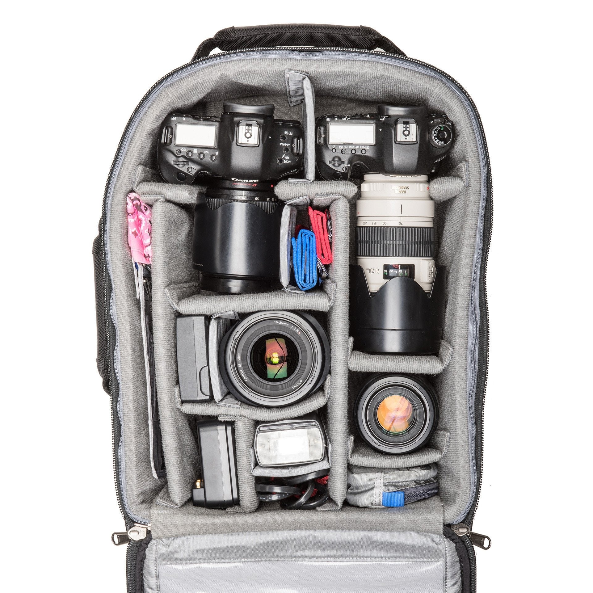 2 gripped DSLRs with lenses attached plus 2–4 additional lenses, 15” laptop and a 10” tablet
