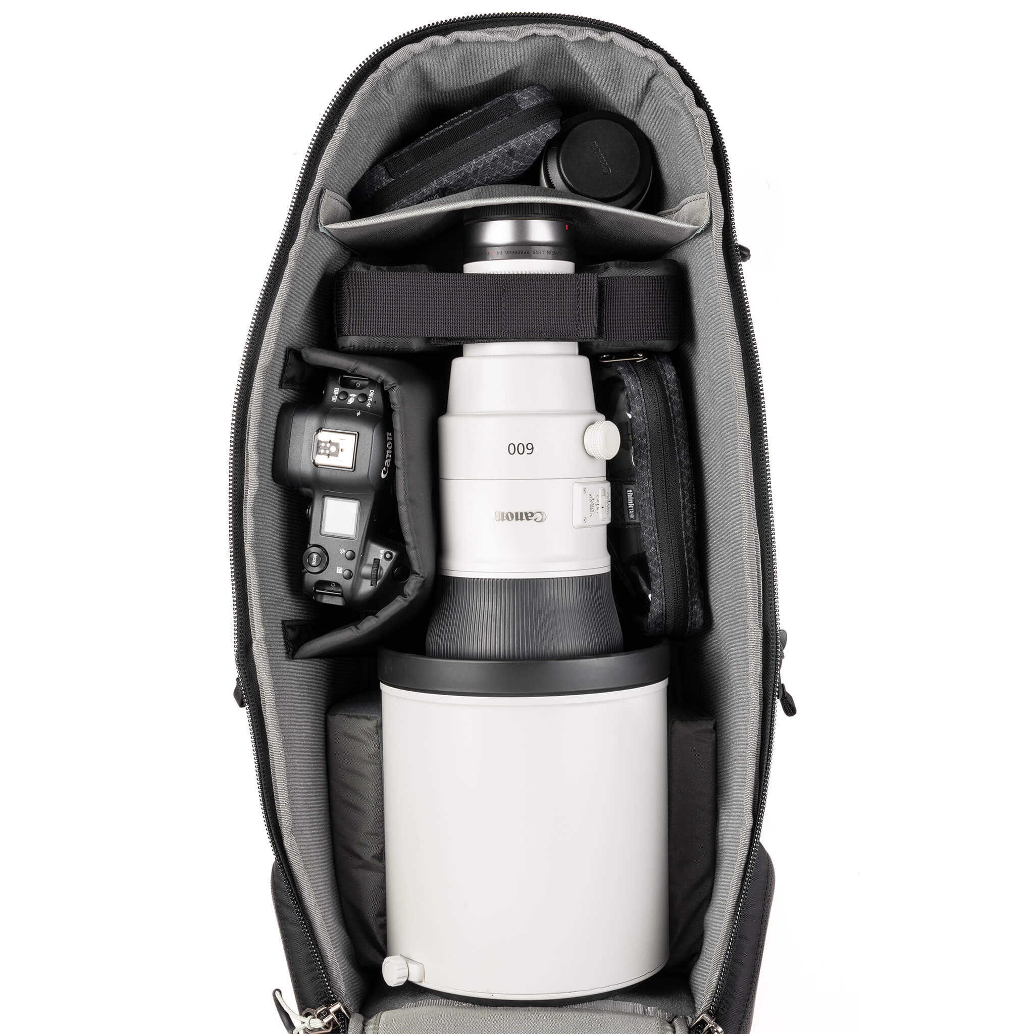 Deep photo compartment for large lens hoods up to 8 inches in diameter, gripped bodies, vertical storage of long lenses, and stacking of short lenses.