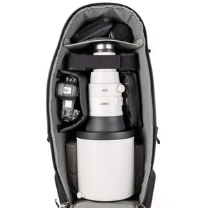 Deep photo compartment for large lens hoods up to 8 inches in diameter, gripped bodies, vertical storage of long lenses, and stacking of short lenses.