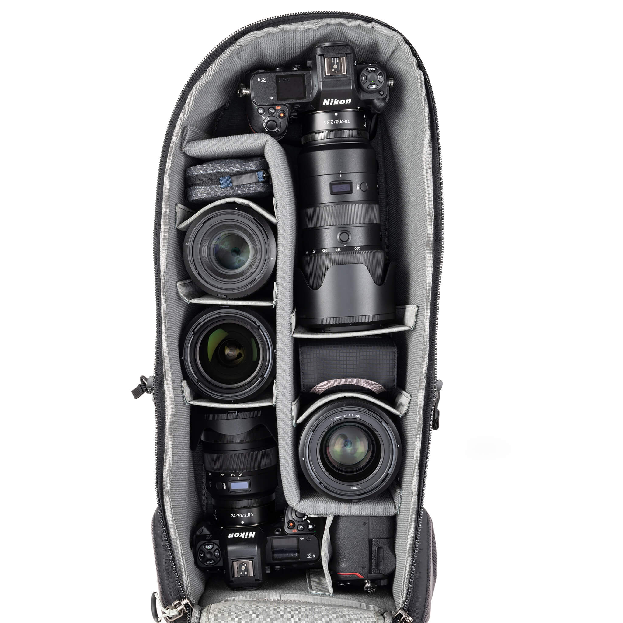 Alternatively carries a large kit consisting of two gripped bodies attached to lenses, plus room for an additional 2-6 lenses and/or accessories