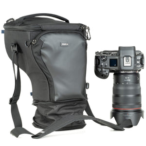 Fits a gripped camera body with a 24-70mm f/2.8 with the hood extended. Popped-down, it fits a 70-200mm f/2.8 with its hood reversed.