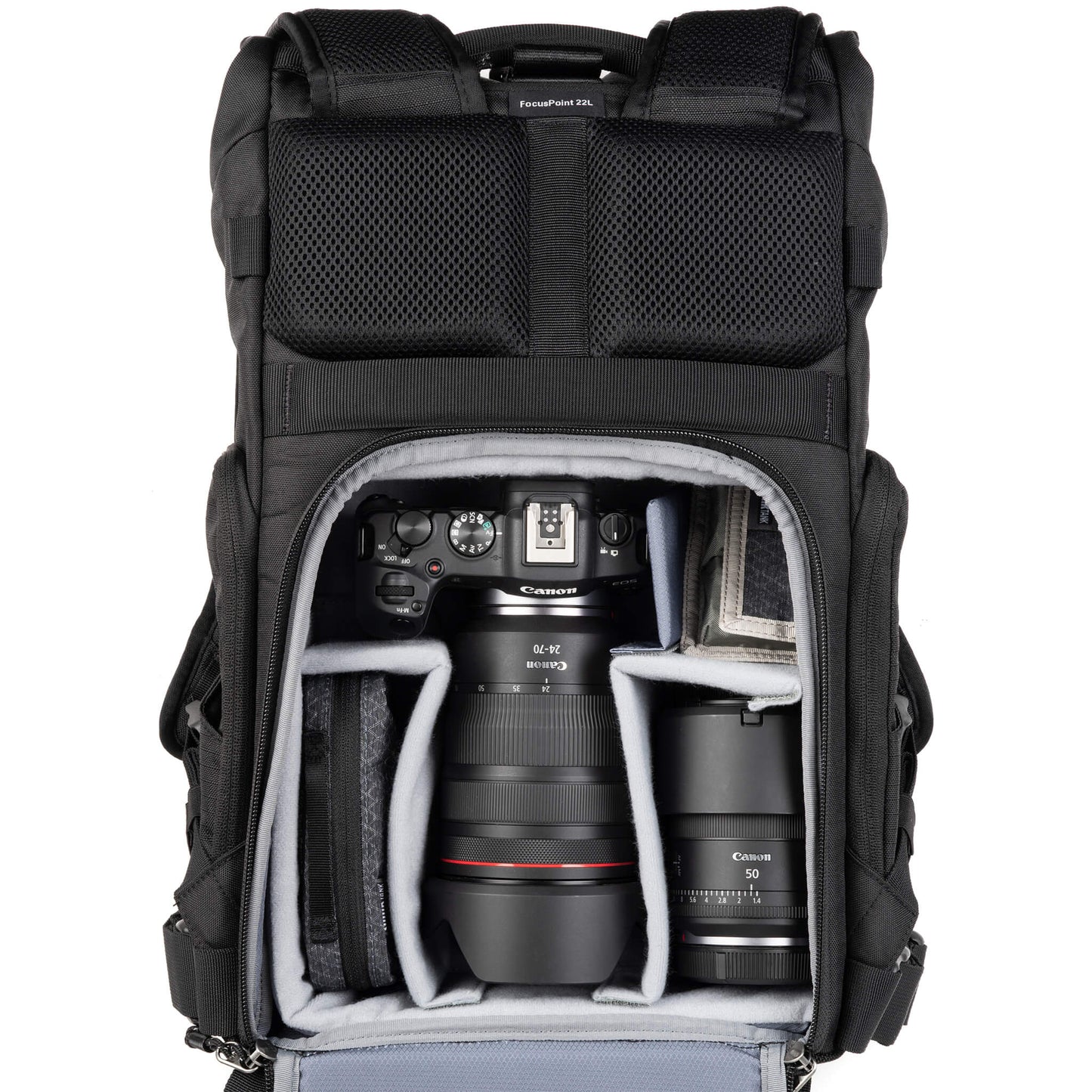 Canon R5 with 24-70mm f/2.8, 50 f/1.4, accessories. Configured for back access.