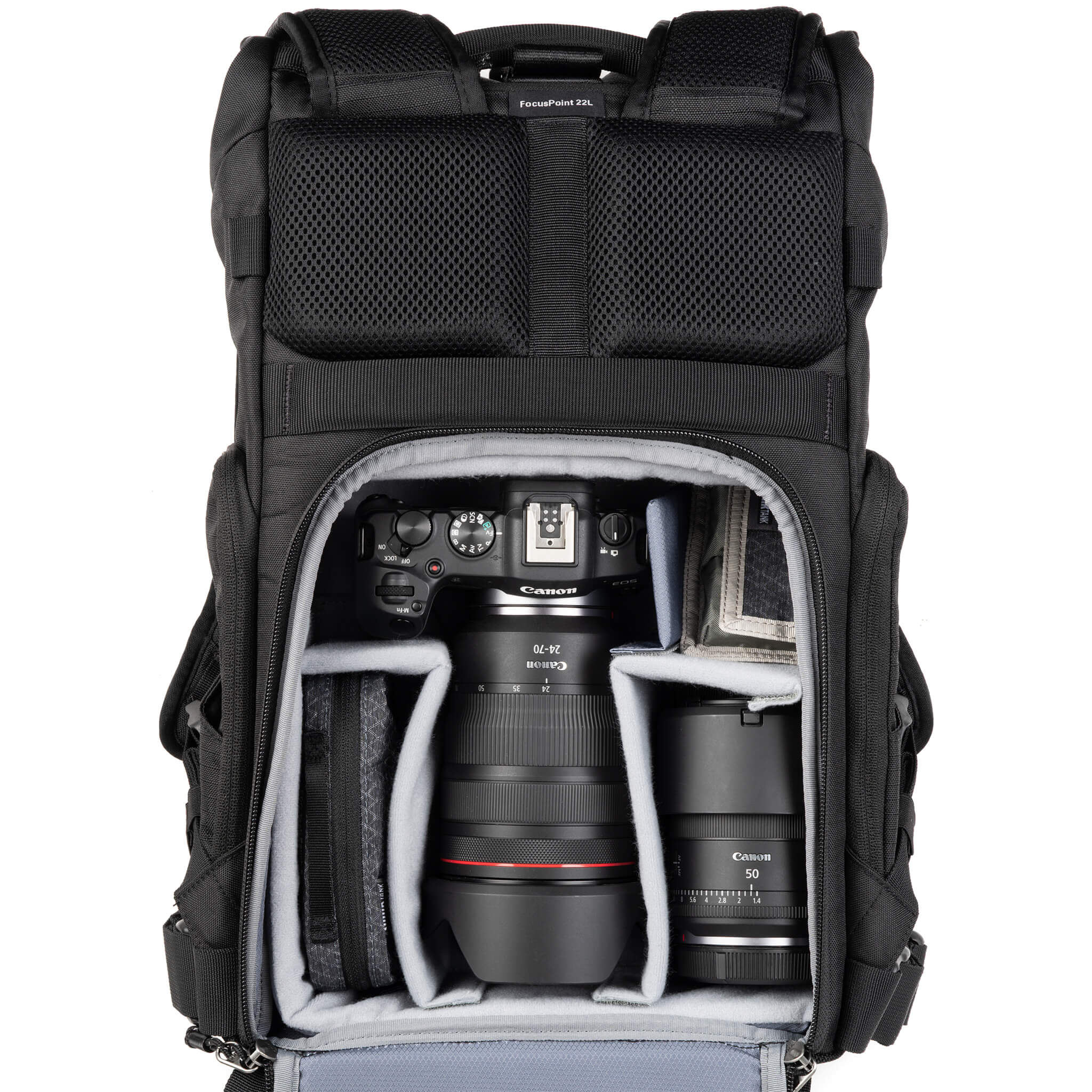 Canon R5 with 24-70mm f/2.8, 50 f/1.4, accessories. Configured for back access.