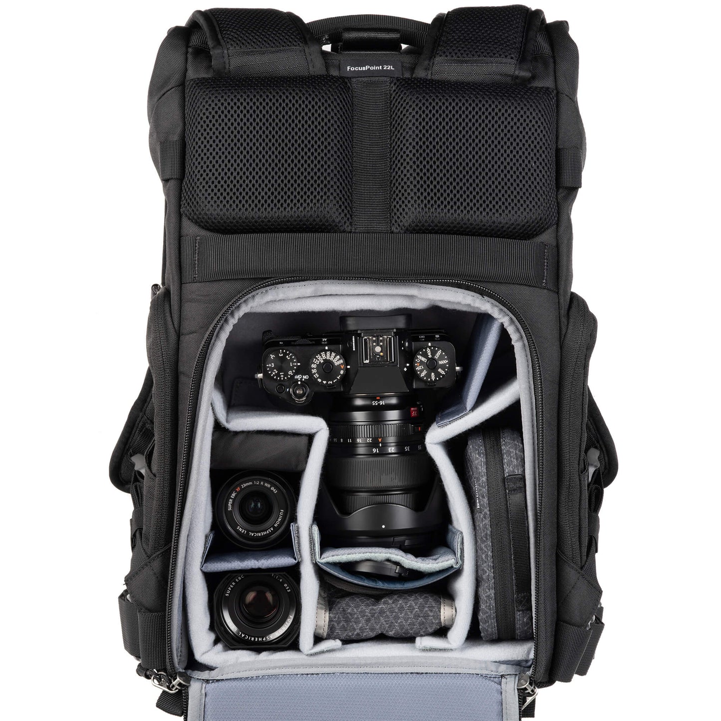 
                  
                    Fuji X-Series X-T5 attached to 16-55mm f/2.8, 23mm f/2, 35mm f/1.4, accessories. Configured for back access. 
                  
                