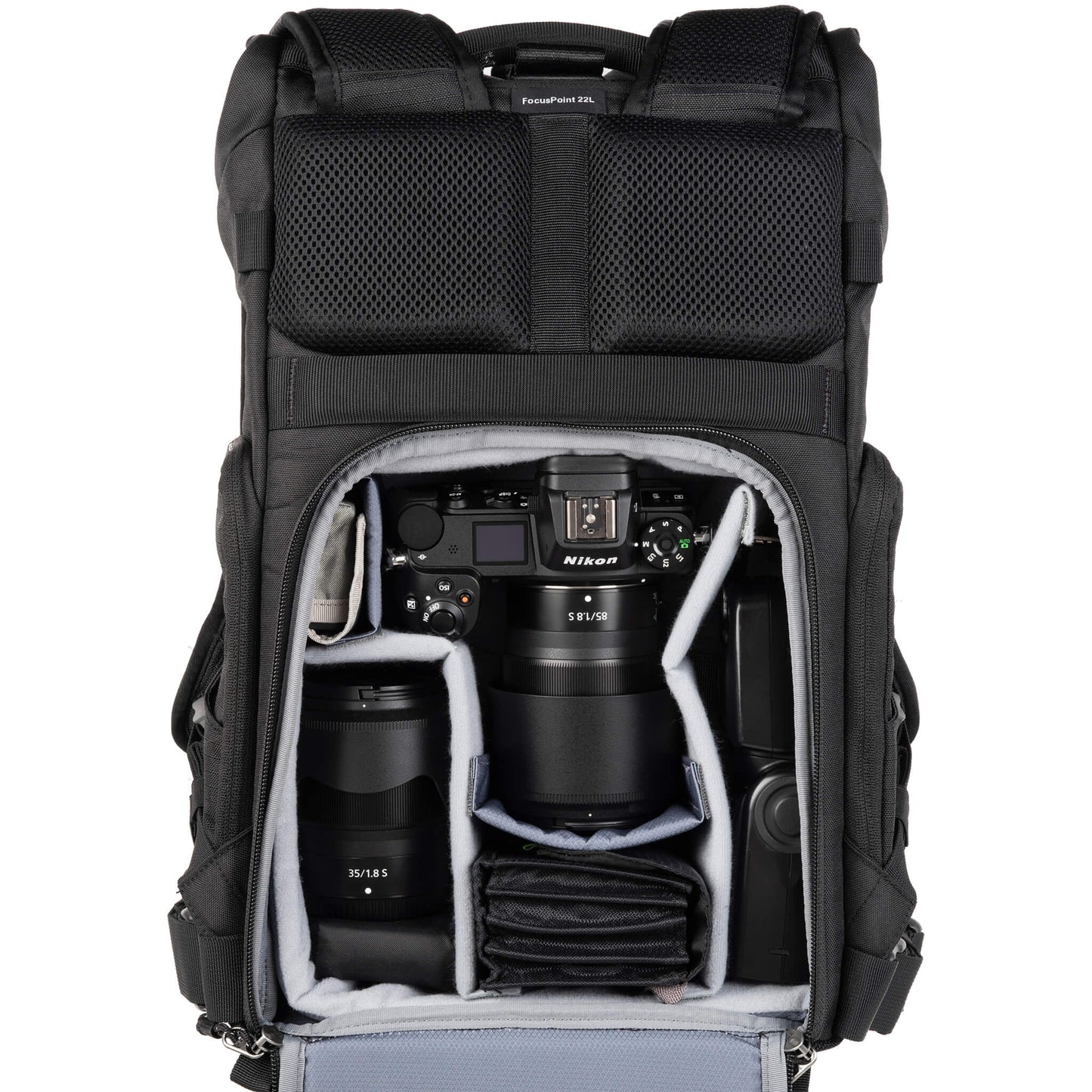 
                  
                    Nikon Z6 attached to 85mm f/1.8, 35mm f/1.8, flash, accessories. Configured for back access.
                  
                