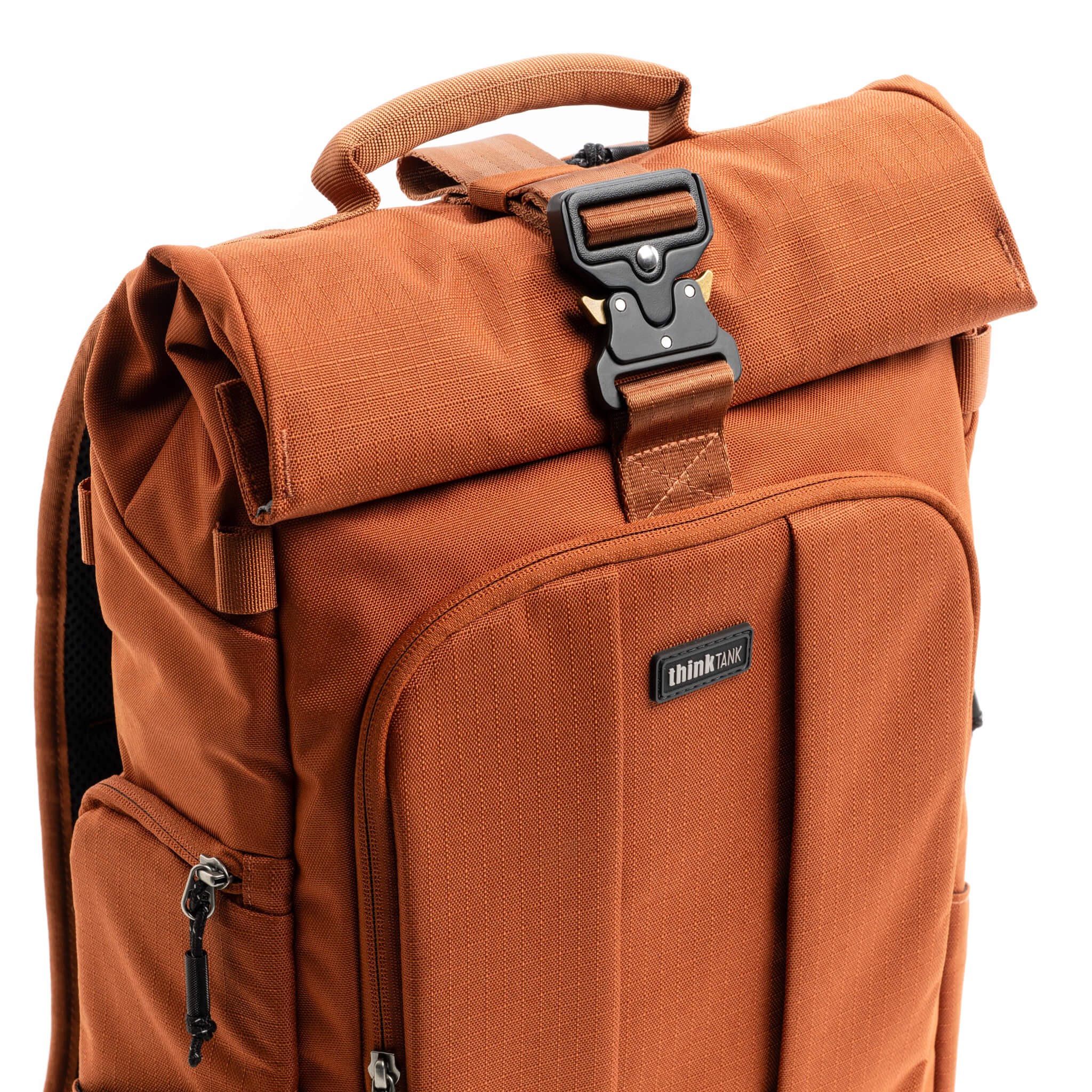 Quick-release parachute-style buckle secures the expandable roll top compartment