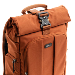 Quick-release parachute-style buckle secures the expandable roll top compartment