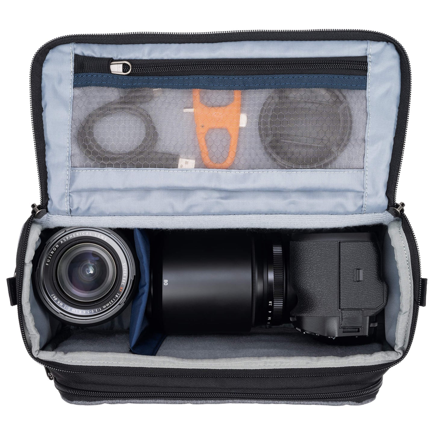 Fits one standard mirrorless body plus 2 to 3 lenses: short to medium f/4 zooms or short to medium primes.