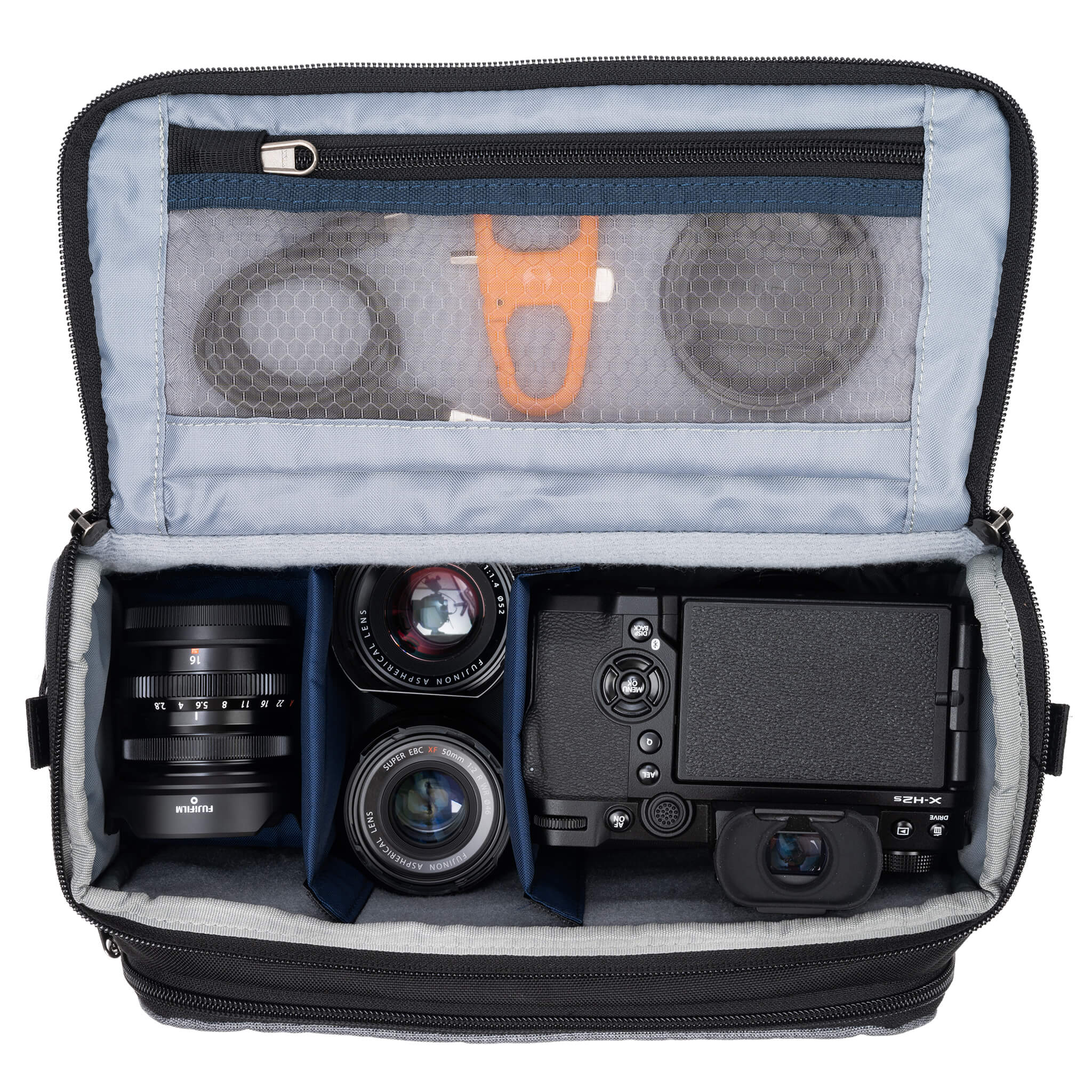 Fits one standard mirrorless body plus 2 to 3 lenses: short to medium f/4 zooms or short to medium primes.