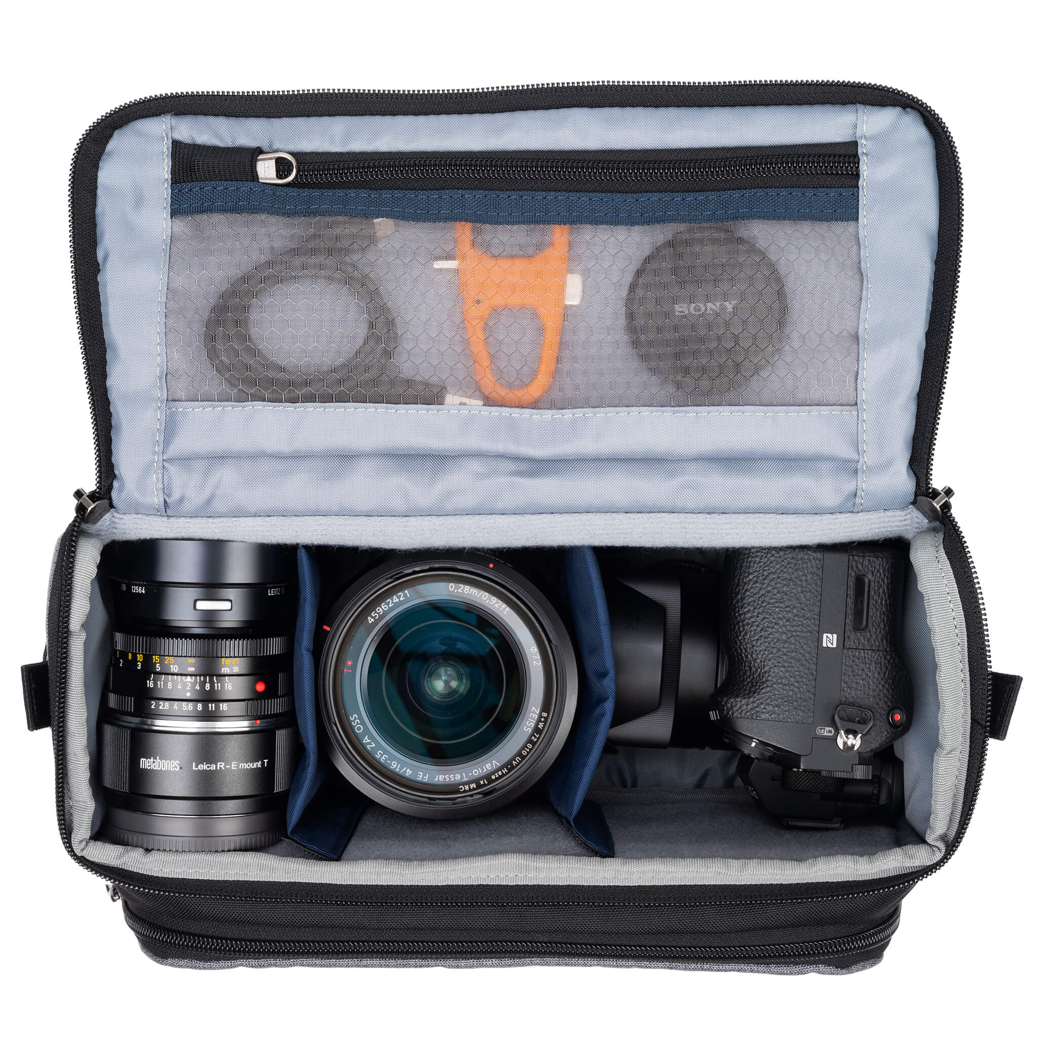 Fits one standard mirrorless body plus 2 to 3 lenses: short to medium f/4 zooms or short to medium primes.