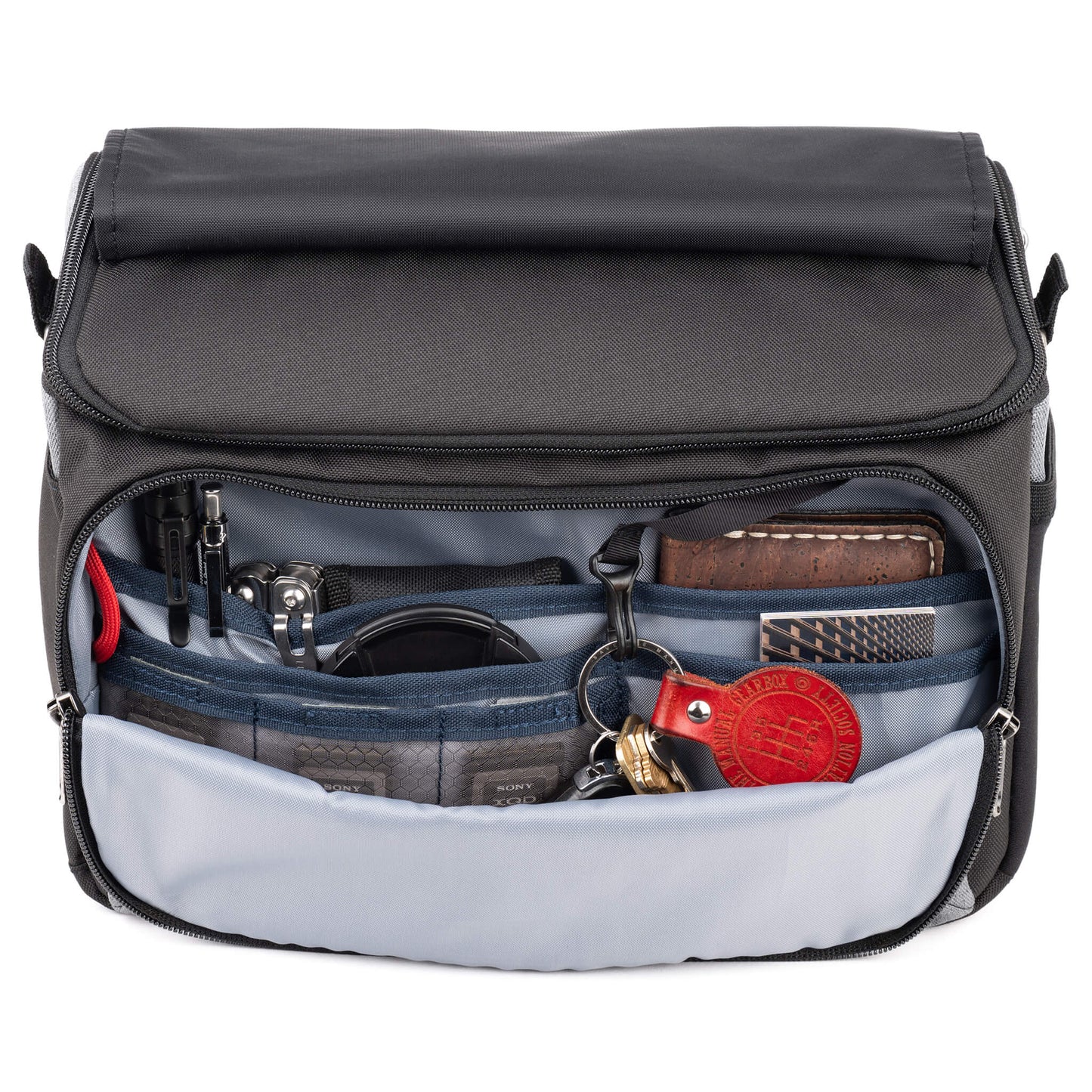 
                  
                    Flip-top lid with magnetic closure provides quick access to gear
                  
                