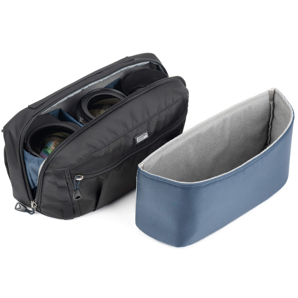 
                  
                    Removable interior padded insert for photographers who need less foam to increase space in the bag.
                  
                