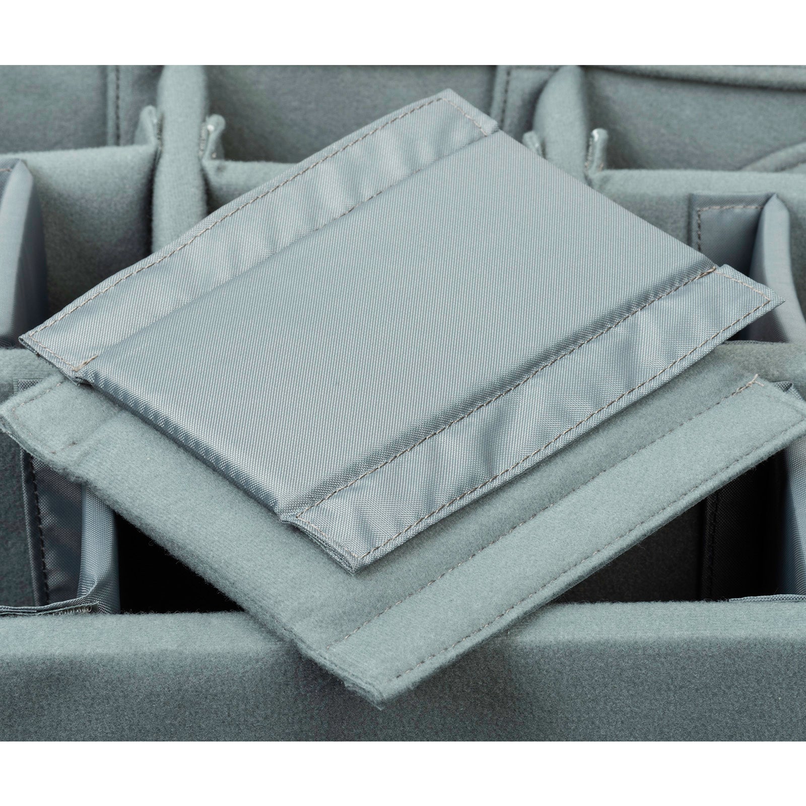 Closed-cell foam dividers support heavy gear and maintain strength over time