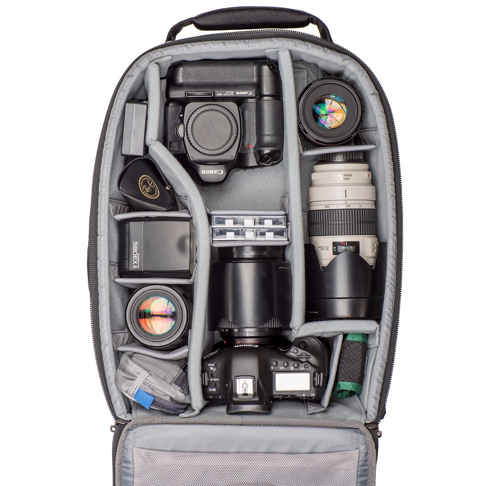 Gripped Canon body, standard body with lens attached, three additional lenses, flash