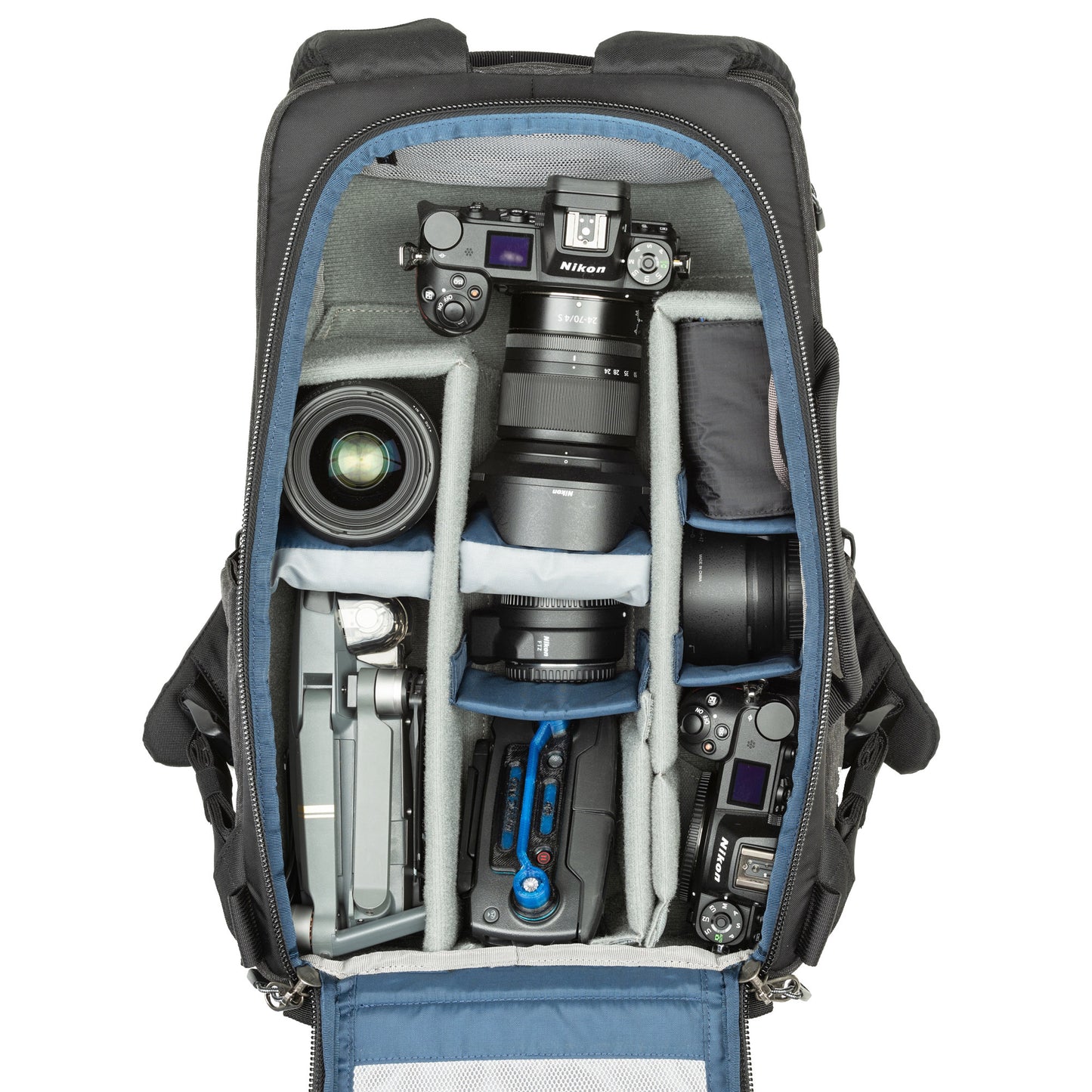 
                  
                    1-2 ungripped DSLR body or Mirrorless System with 70–200mm f/2.8 attached, 2-5 additional lenses, a flash, 16” laptop, plus personal gear.
                  
                