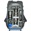 1–2 ungripped DSLR or Mirrorless bodies with lens attached up to a 70–200mm f/2.8, 2–5 additional lenses, a strobe, a 16” laptop, plus personal gear