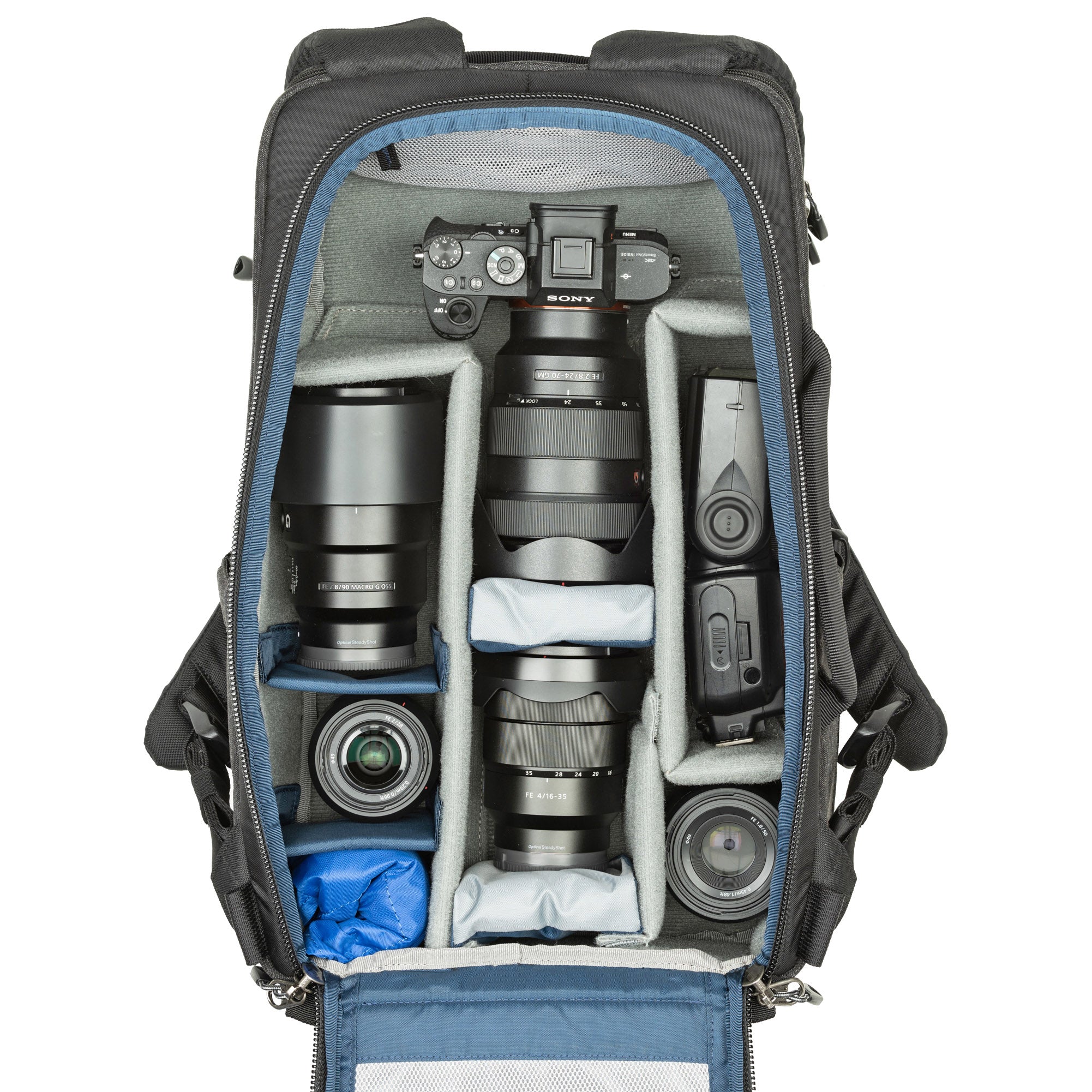 1–2 ungripped DSLR or Mirrorless bodies with lens attached up to a 70–200mm f/2.8, 2–5 additional lenses, a strobe, a 16” laptop, plus personal gear