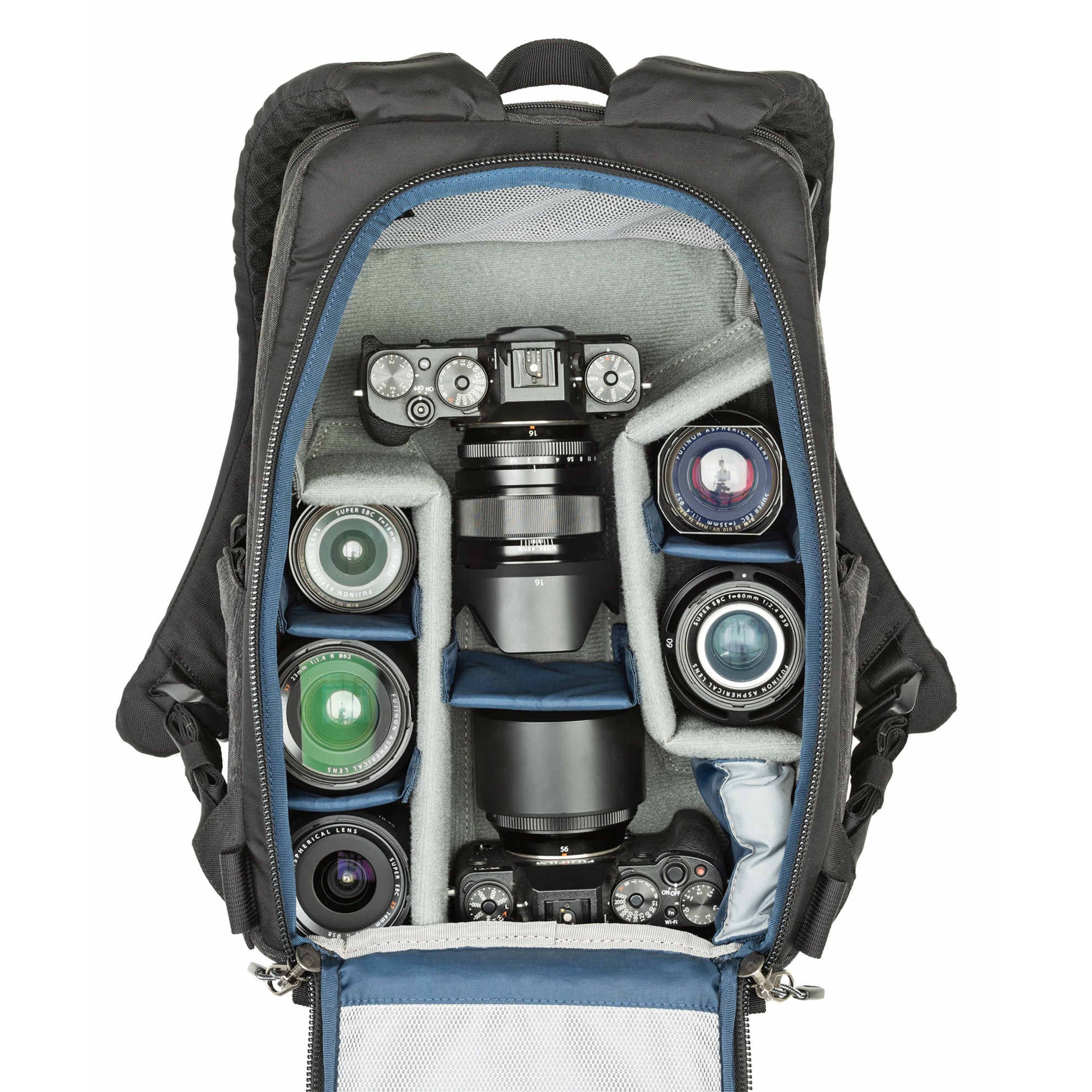 1–2 ungripped cameras with lens attached up to a 70–200mm f/2.8, 1–3 additional lenses, a strobe, a 13” laptop, plus personal gear