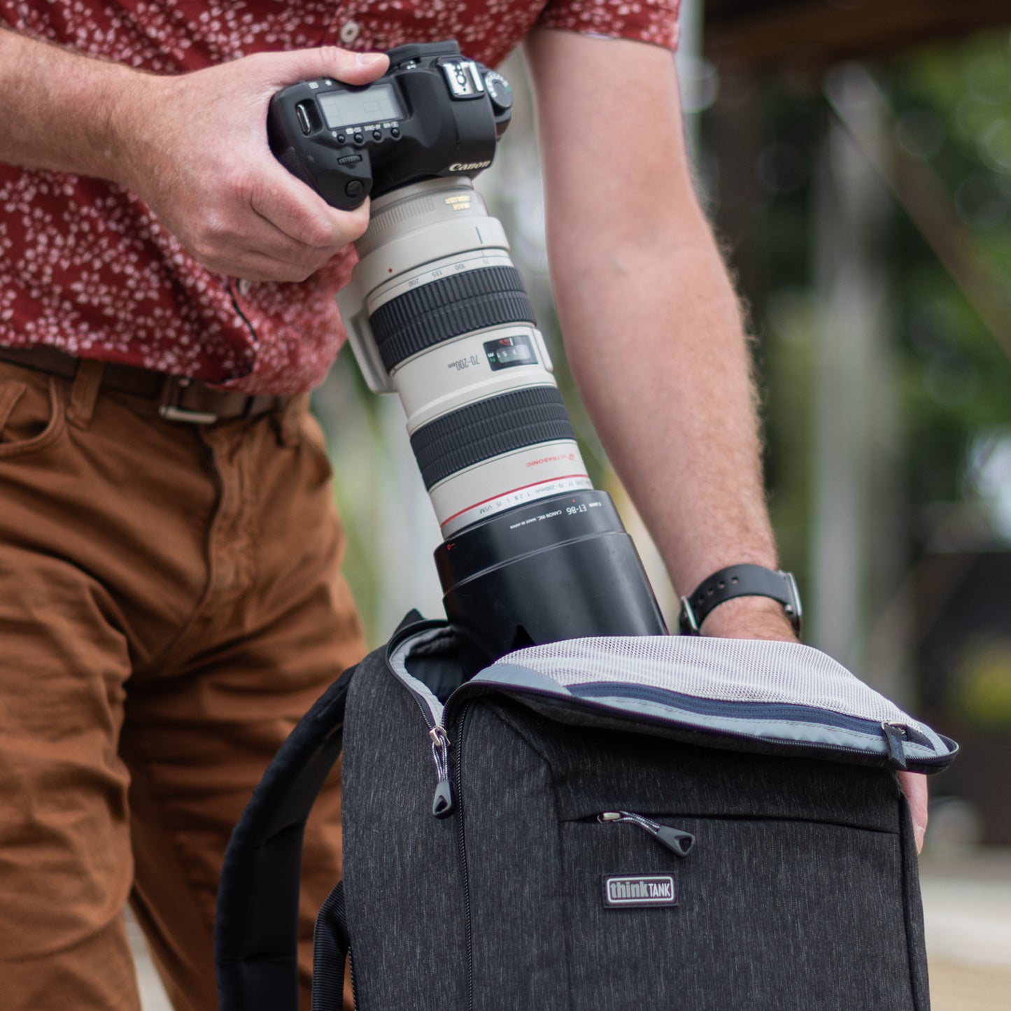 
                  
                    Top zippered panel provides quick access to camera gear
                  
                