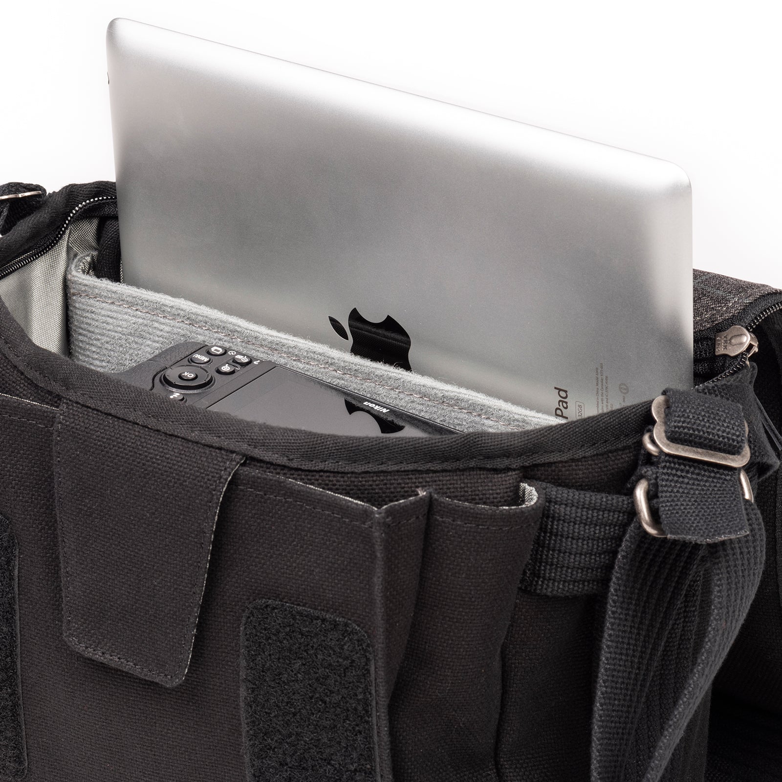 Dedicated pockets fit a 10" tablet and a 13" laptop