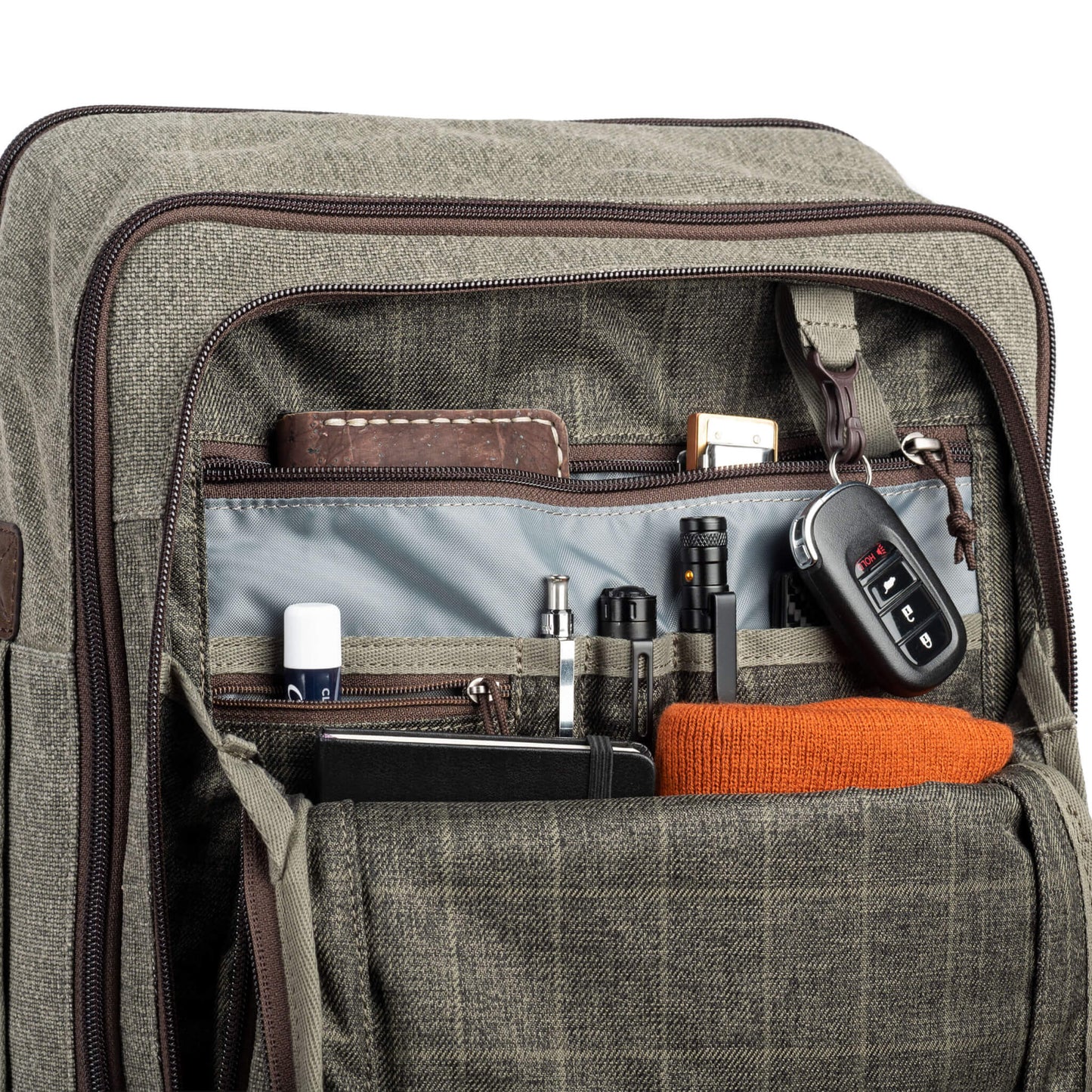 
                  
                    Deep, pleated front pocket with organizer panel, zippered interior pockets, and key lanyard
                  
                