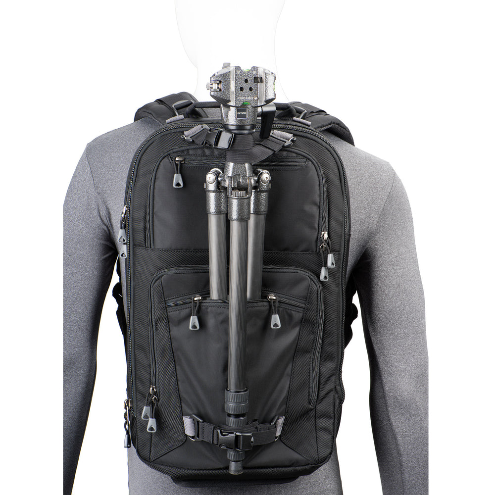 
                  
                    Tripod carry on front of bag keeps weight centered and allows you to access gear without detaching the tripod
                  
                